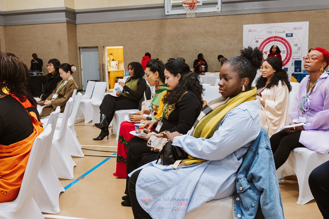 Women sitting together and listening at a previous Safe Haven Conference